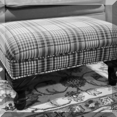 F65a. Footstoolwith plaid upholstery. 9”h x 18”w x 13”d - $38